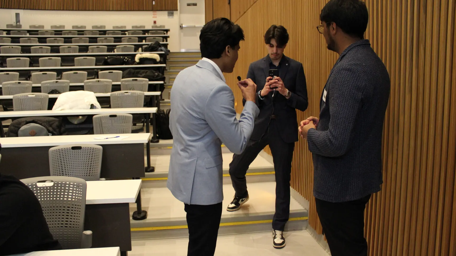 Miking up before the panel — UTM lecture hall