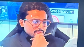 Safwan Hossain reading notes on the broadcast desk