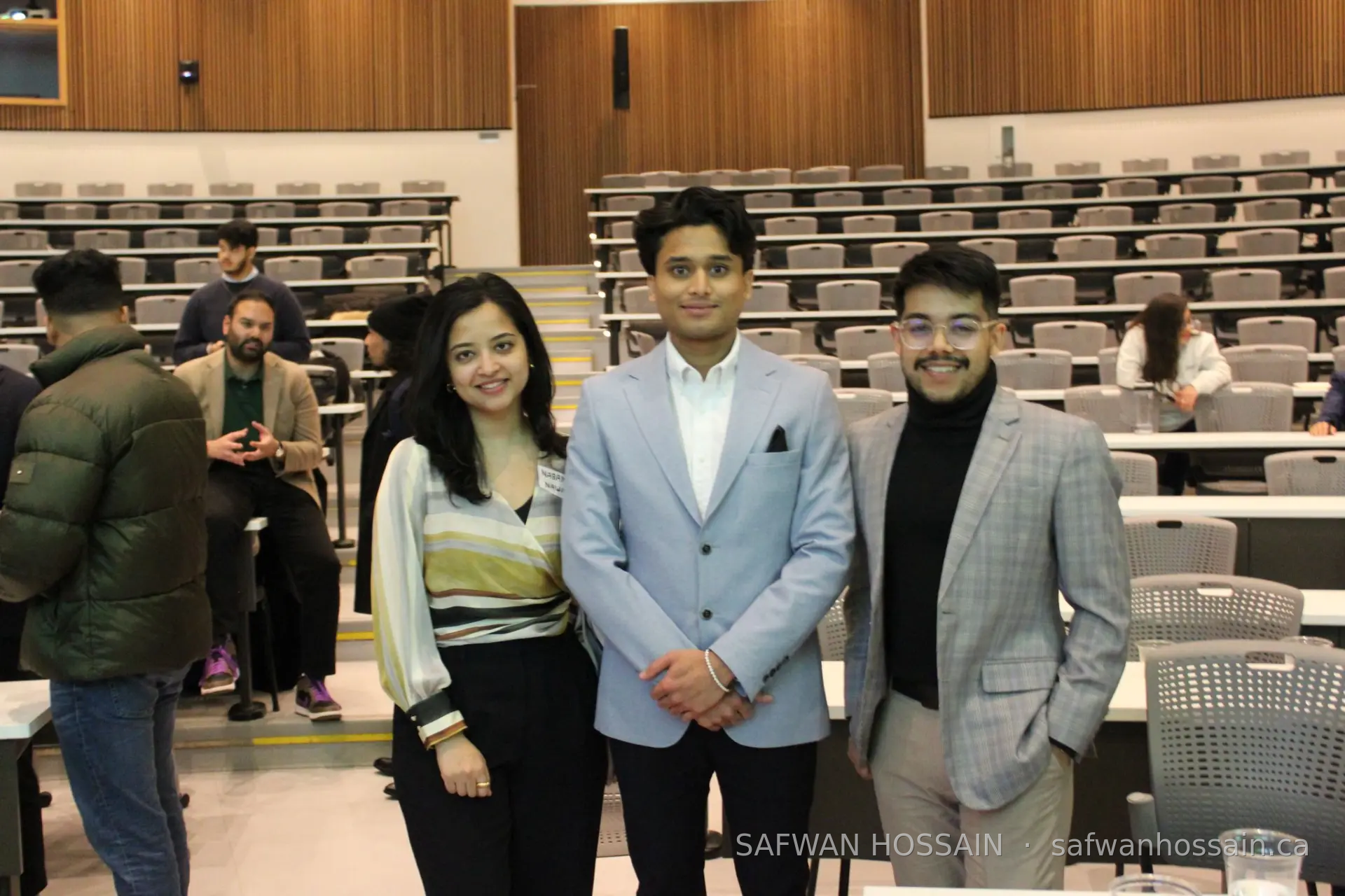 Safwan Hossain standing with two BSA executives in the lecture hall